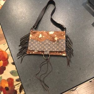 Louis Vuitton piece on handmade leather purse